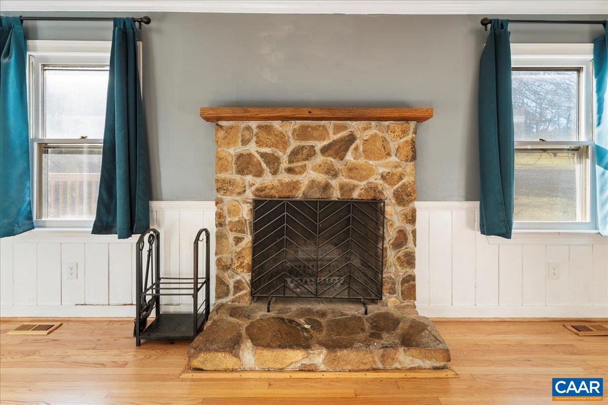 555 Gillums Ridge Road Charlottesville, VA 22903 - Photo 16 of 66 a living room with furniture and a fireplace