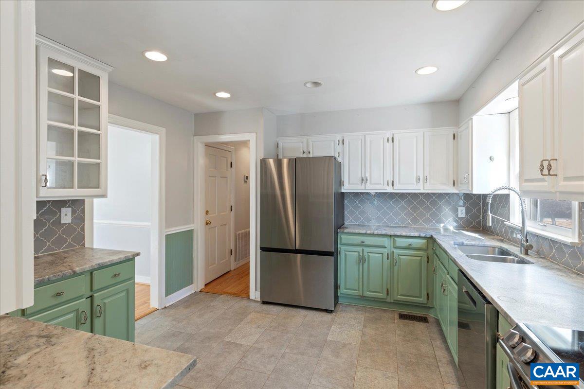 555 Gillums Ridge Road Charlottesville, VA 22903 - Photo 19 of 66 a kitchen with stainless steel appliances granite countertop a refrigerator and a sink