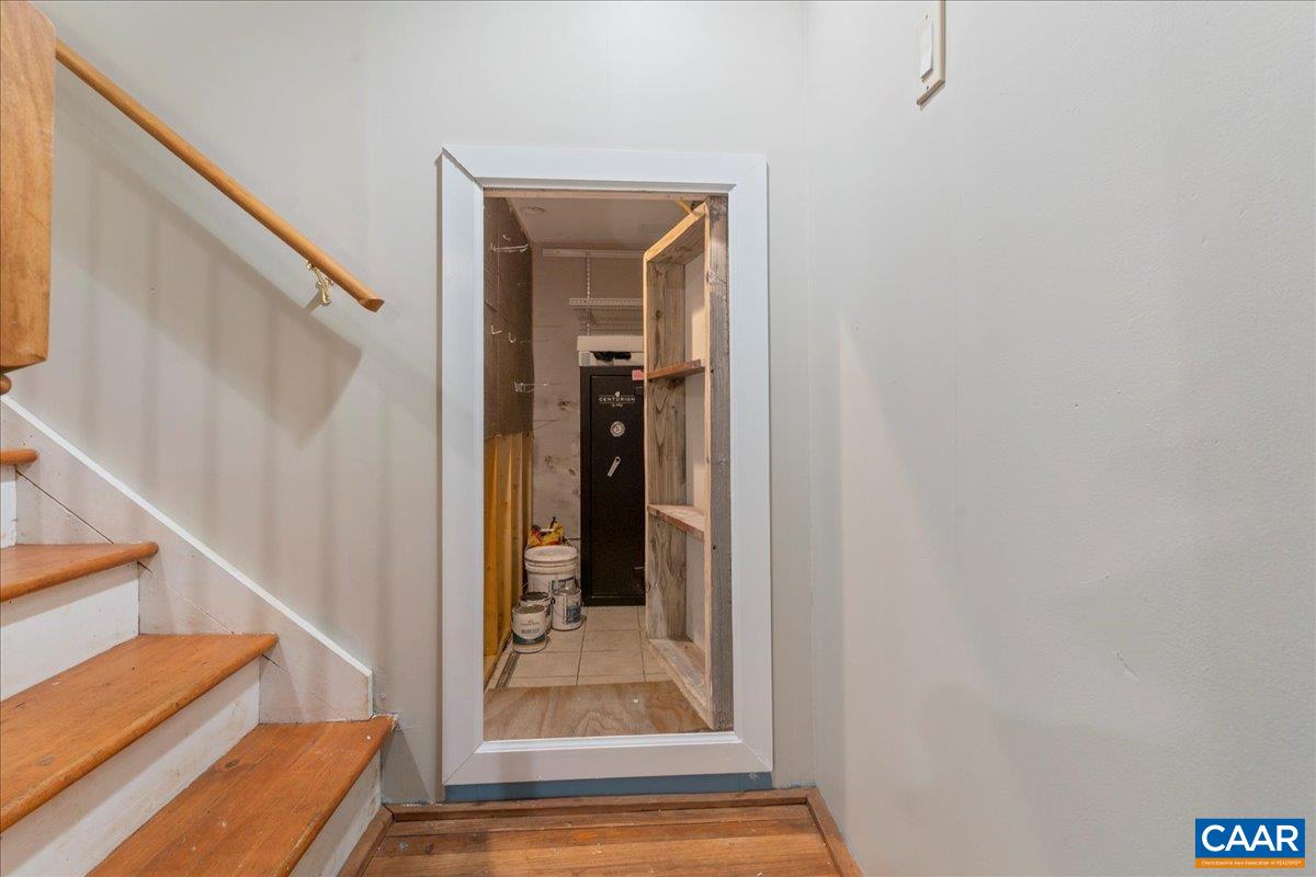 555 Gillums Ridge Road Charlottesville, VA 22903 - Photo 40 of 66 a view of staircase with wooden floor and a rug