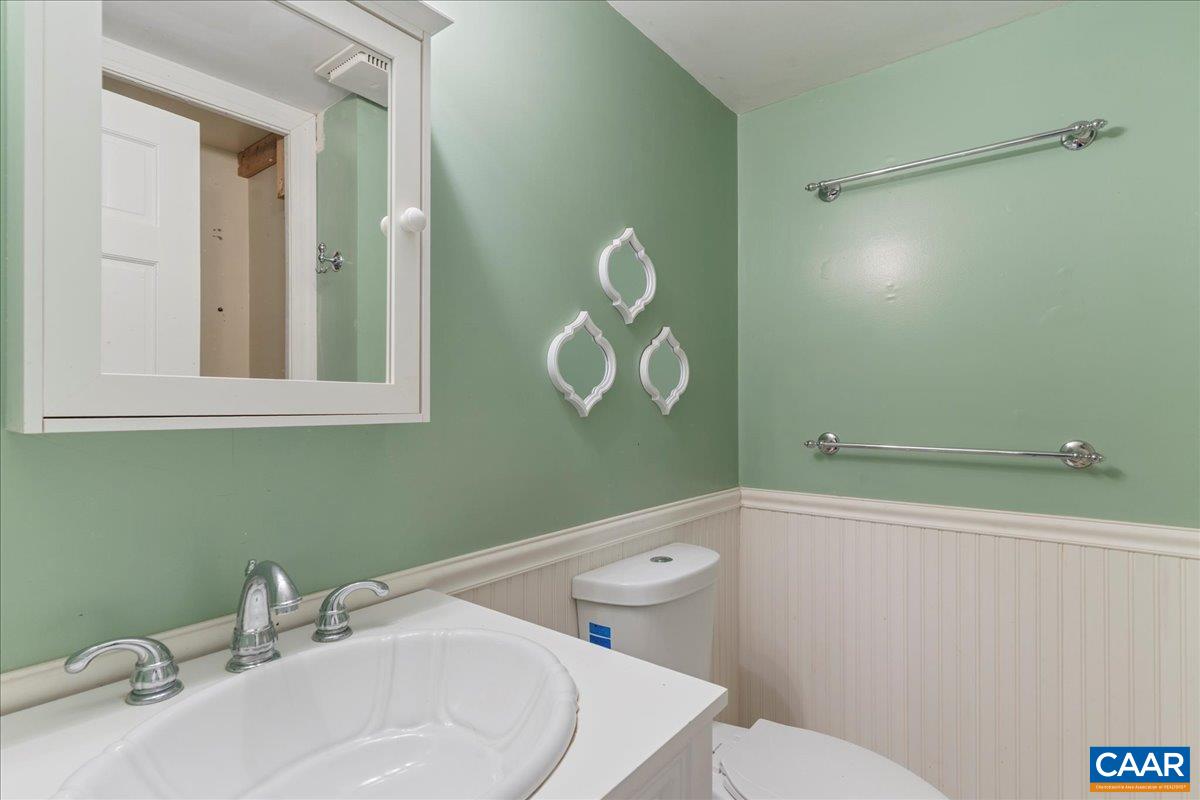 555 Gillums Ridge Road Charlottesville, VA 22903 - Photo 43 of 66 a bathroom with a sink and mirror