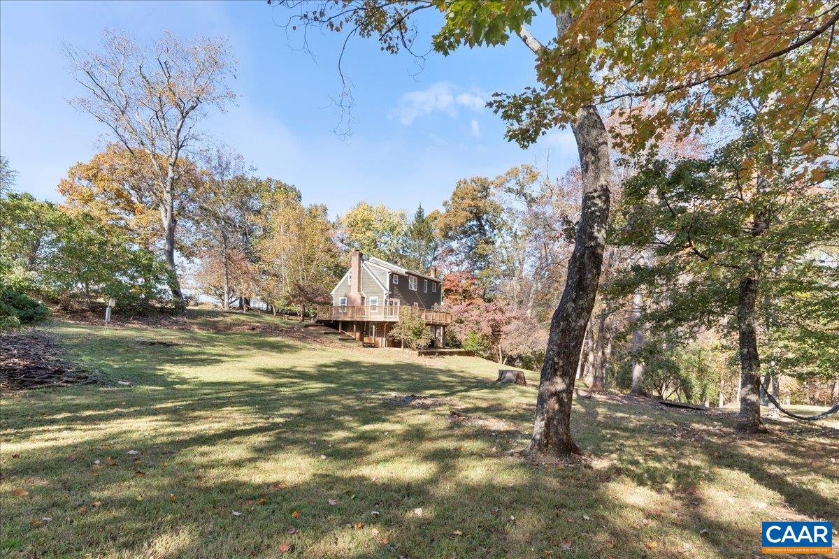 555 Gillums Ridge Road Charlottesville, VA 22903 - Photo 52 of 66 a view of a yard with large trees