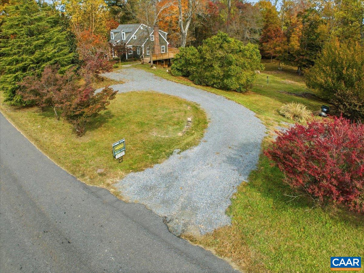 555 Gillums Ridge Road Charlottesville, VA 22903 - Photo 64 of 66 a view of a swimming pool with a yard and large trees