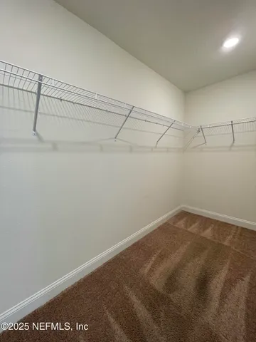 a view of a room with racks on the wall