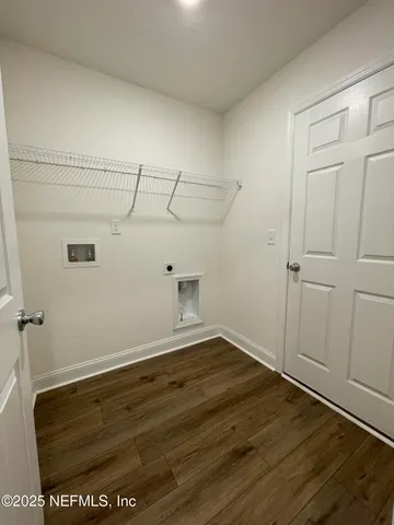 a view of swimming pool with a tub and trees in the background