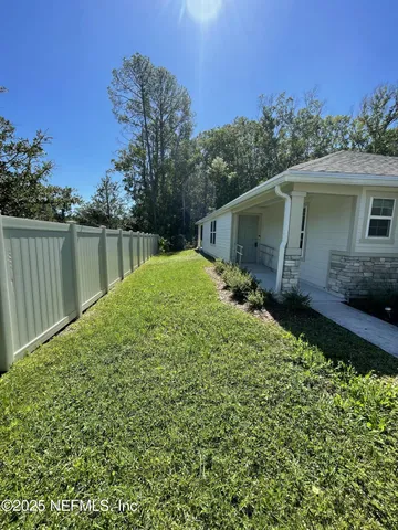 a backyard of a house with lots of green space