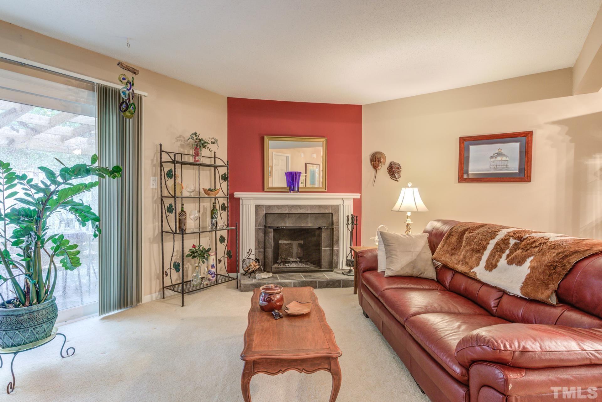 817 Green Ridge Drive Raleigh, NC 27609 - Photo 12 of 24 Cozy up to this wood burning fireplace on a cold night. Updated surround.