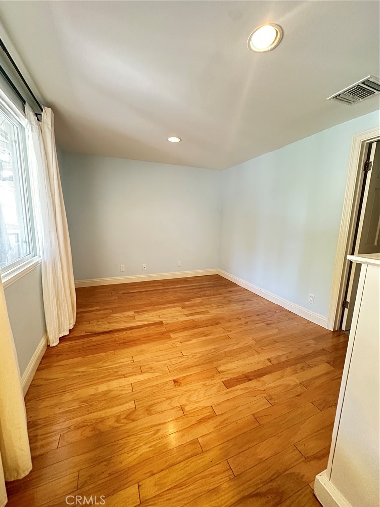 848 Monte Verde Drive Arcadia, CA 91007 - Photo 13 of 22 a view of empty room with wooden floor and fan