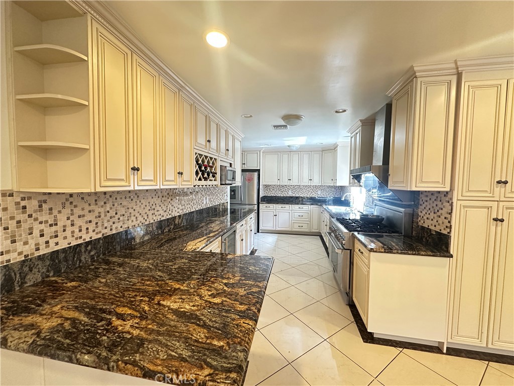 848 Monte Verde Drive Arcadia, CA 91007 - Photo 15 of 22 a kitchen with stainless steel appliances granite countertop a sink and a stove