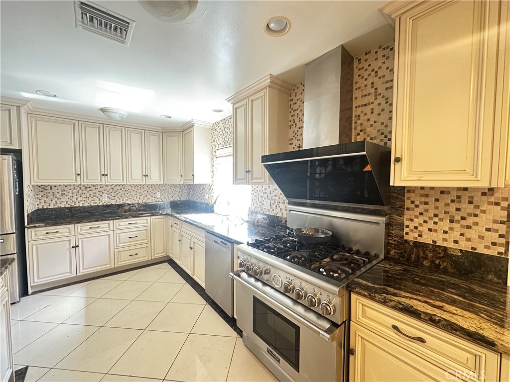 848 Monte Verde Drive Arcadia, CA 91007 - Photo 16 of 22 a kitchen with a stove a sink and a refrigerator