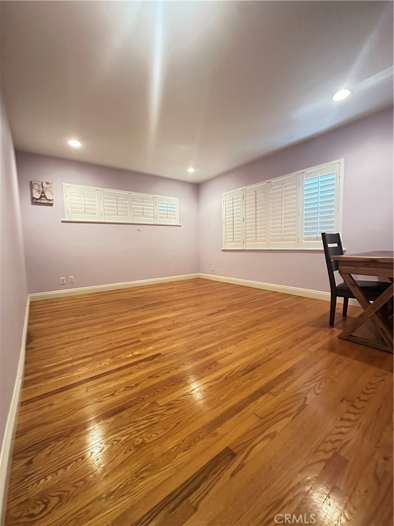 848 Monte Verde Drive Arcadia, CA 91007 - Photo 8 of 22 an empty room with wooden floor and windows