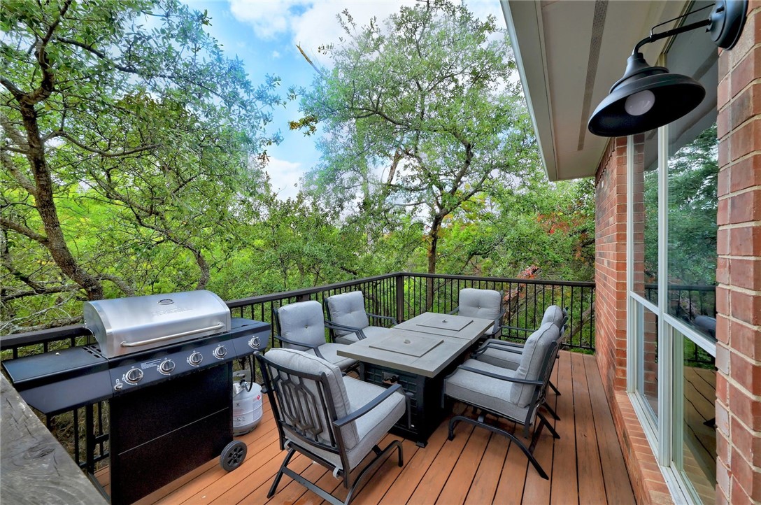 Back deck with view of greenbelt and trees