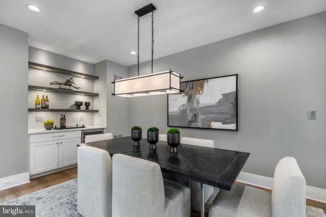 a view of a room with rack on the wall and a window