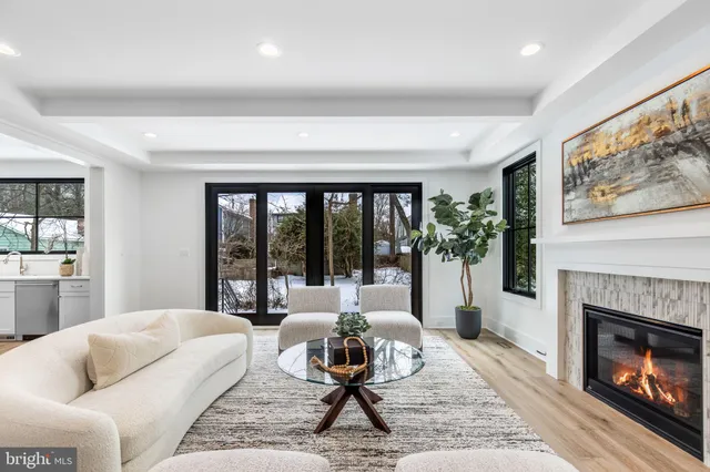a white bath tub sitting in front of a window