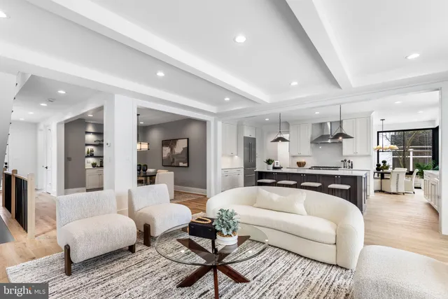 a bathroom with a double vanity sink mirror and next to a window