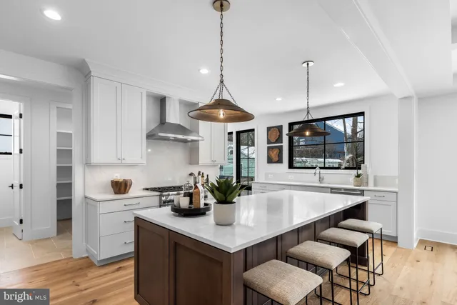 a bedroom with a bed and large window