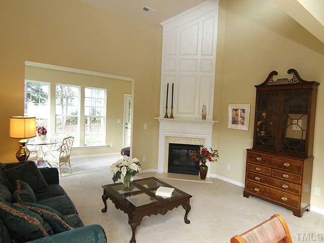 3805 Cathedral Bell Road Raleigh, NC 27614 - Photo 1 of 24 Soaring architectural feature above the fireplace adds a touch of pure elegance. Extensive upgraded crown moldings throughout plus custom paint colors. Number 2 green right through your sunroom windows. Get out there and practice your short game!