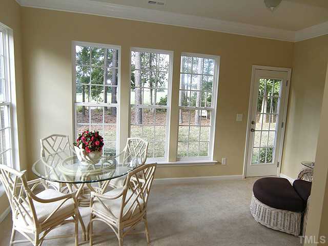 3805 Cathedral Bell Road Raleigh, NC 27614 - Photo 13 of 24 We finish our downstairs tour of the living areas in the sun room. Make it what you wish. Game room, reading room, music room, it's your choice. Whatever you choose, you can view the green from here. I can't think of a much better view, can you?