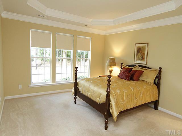 3805 Cathedral Bell Road Raleigh, NC 27614 - Photo 14 of 24 Spacious downstairs master, down a short hallway from the great room area, has trey ceiling, plenty of room for large furnishings, and is augmented by a huge master closet with specialty built-ins you don't want to miss.