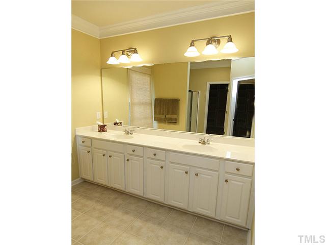 3805 Cathedral Bell Road Raleigh, NC 27614 - Photo 15 of 24 Upscale light fixtures, extra long raised double vanity and more luscious crown moldings are just the beginning...