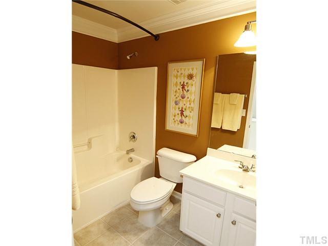 3805 Cathedral Bell Road Raleigh, NC 27614 - Photo 18 of 24 Just one of the three full baths. Note tile floor and upscale lighting fixture.