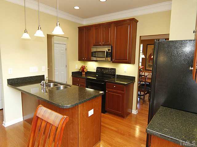 3805 Cathedral Bell Road Raleigh, NC 27614 - Photo 8 of 24 Beautiful triple upgrade cabinets tie everything together.