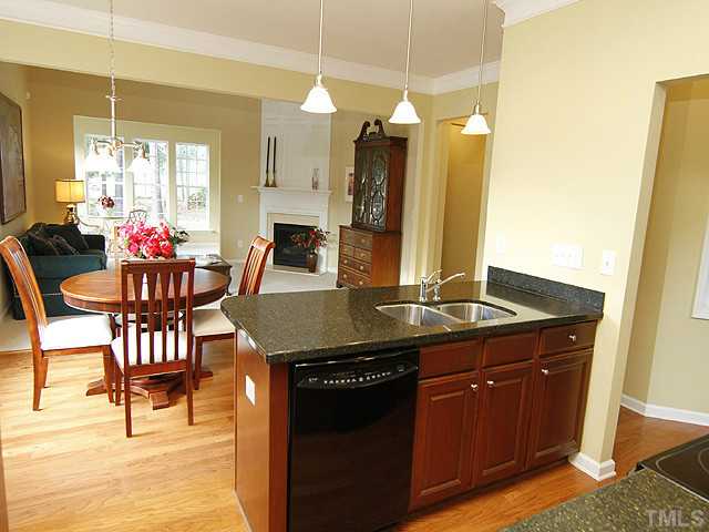 3805 Cathedral Bell Road Raleigh, NC 27614 - Photo 9 of 24 You won't be separated from the activities when you're in the kitchen. You can even see the golf course from here! You'll want to stay in the kitchen, but don't. There's more beauty to enjoy in this home!
