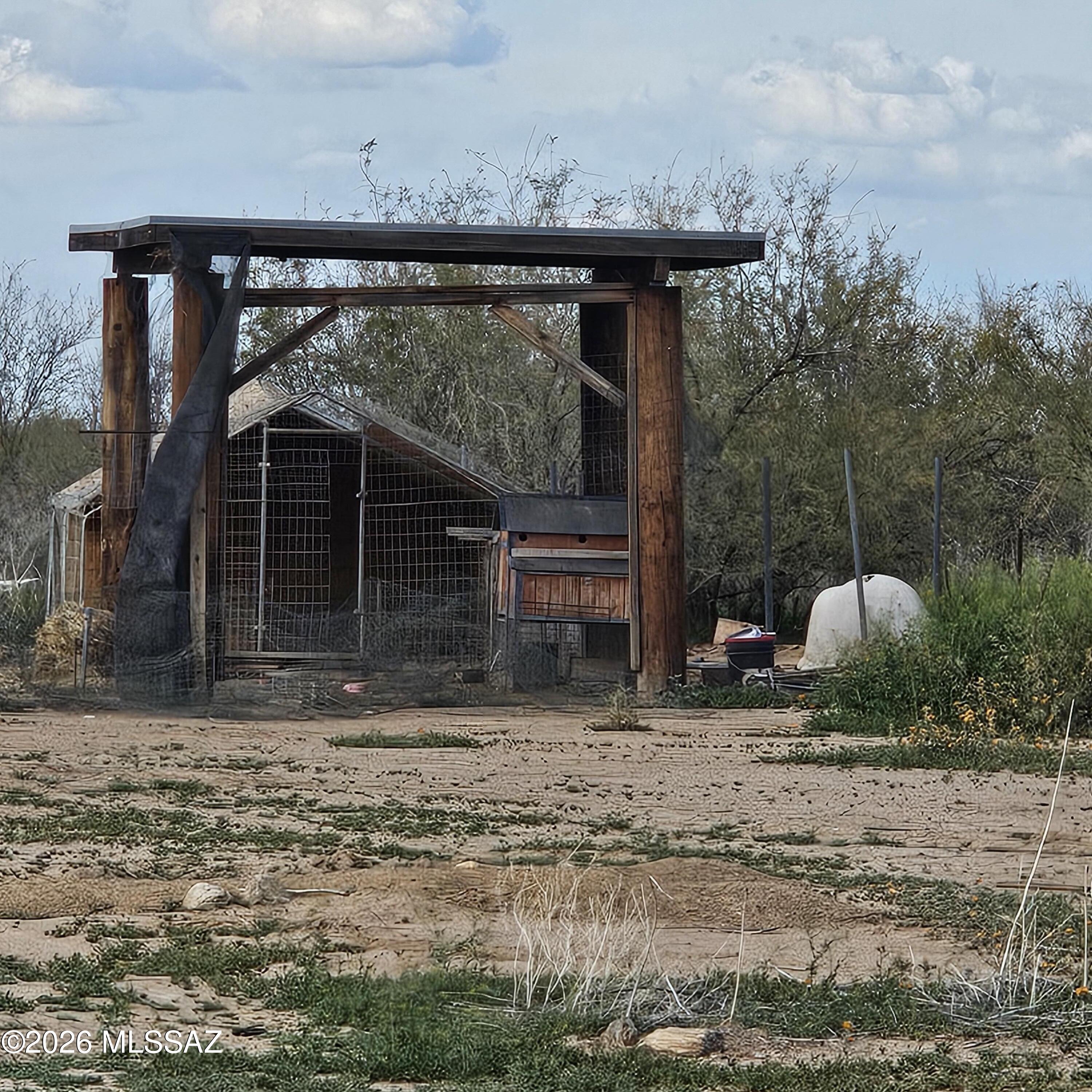 14020 West Park Road Tucson, AZ 85735 - Photo 18 of 18 a view of a house with backyard and trees