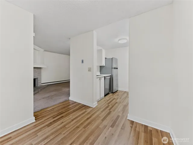 a view of kitchen and wooden floor