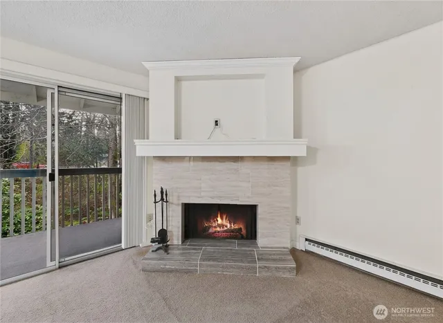 a living room with a fireplace and a window
