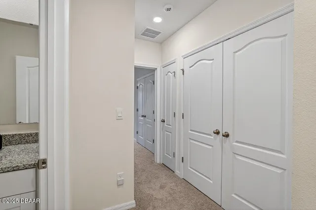 a bathroom with a shower and a glass door