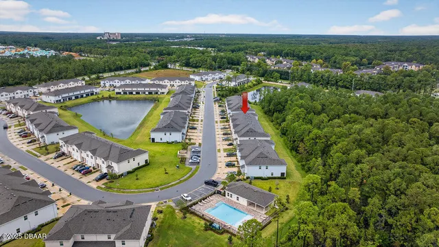an aerial view of a house with outdoor space swimming pool and mountains
