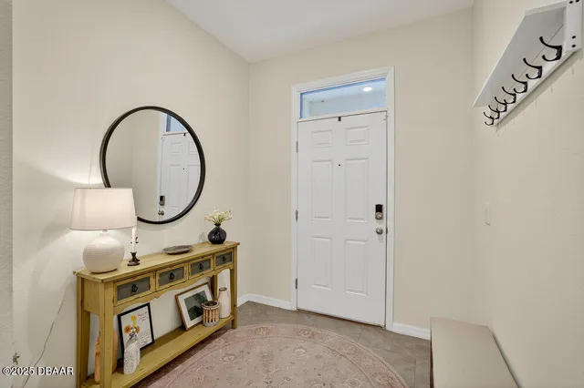 a view of an entryway with wooden floor
