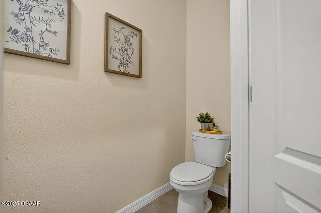 a bathroom with a toilet and a sink