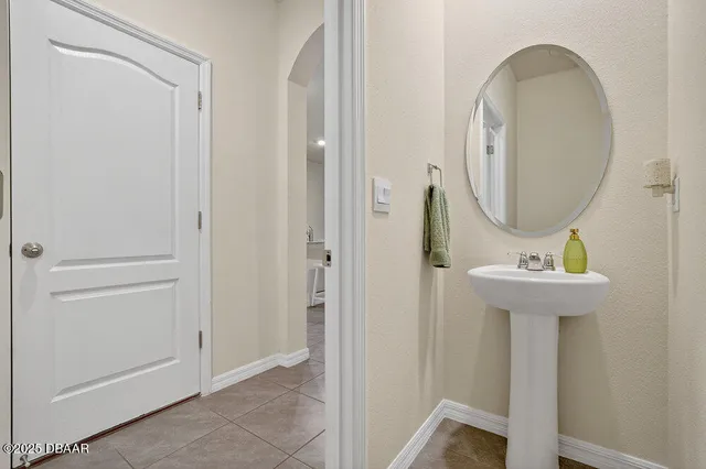 a bathroom with a sink a mirror and a toilet
