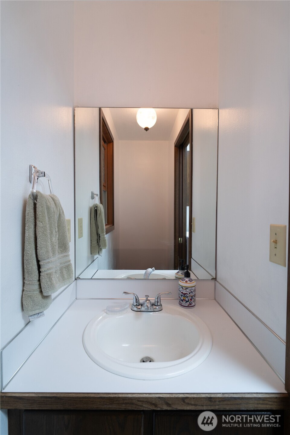 2102 Mark Street Northeast Olympia, WA 98516 - Photo 18 of 37 a bathroom with a sink and mirror