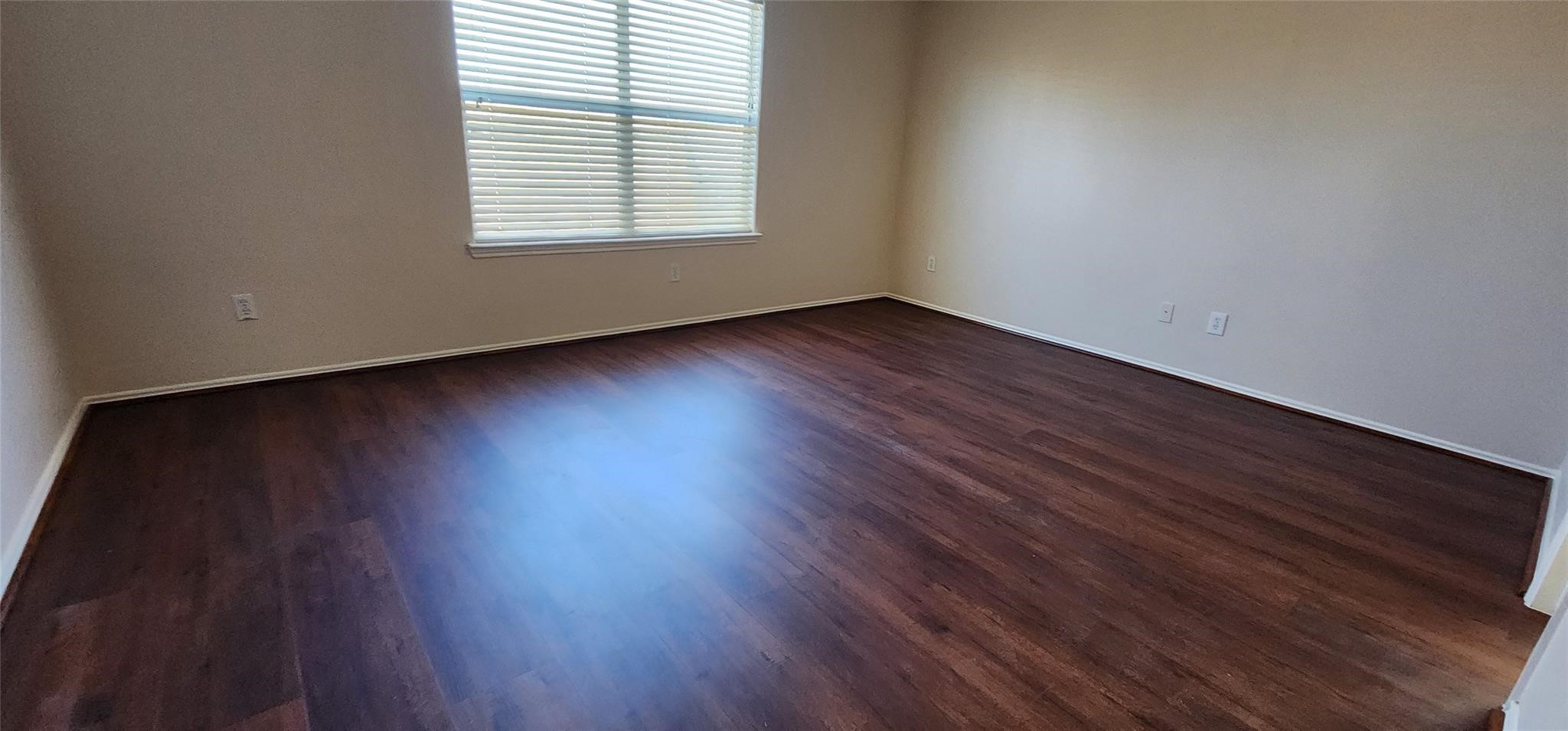315 Sunset Colony Drive Rosharon, TX 77583 - Photo 19 of 20 an empty room with wooden floor and windows