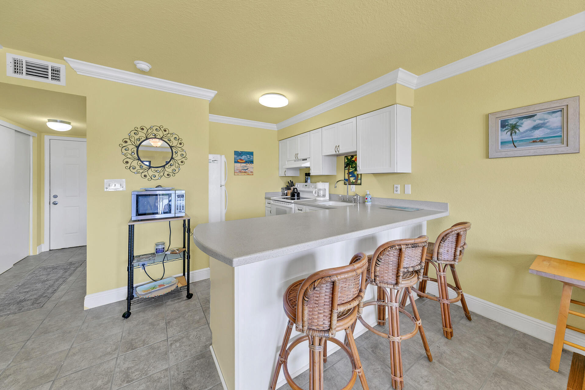 145 Beachfront Trail, Unit 202 Santa Rosa Beach, FL 32459 - Photo 9 of 26 a kitchen with a table and chairs in it