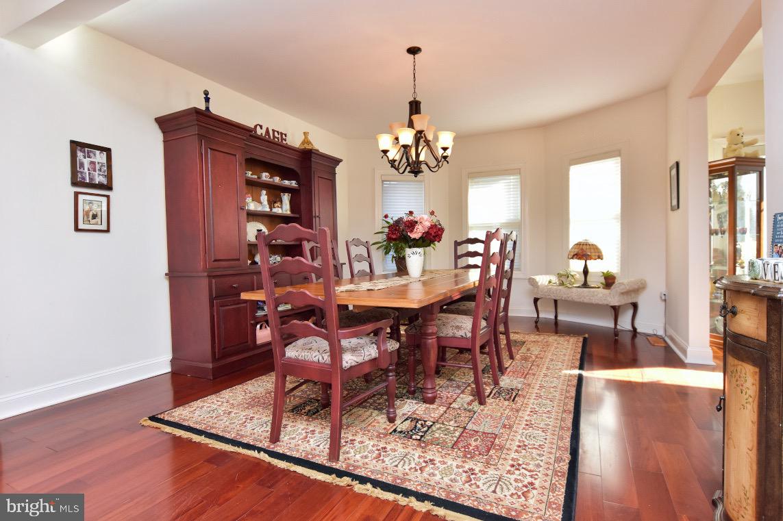 1023 Prospect Ridge Boulevard Haddon Heights, NJ 08035 - Photo 13 of 44 a view of a dining room with furniture and wooden floor