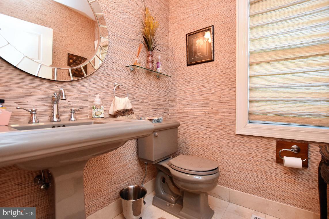 1023 Prospect Ridge Boulevard Haddon Heights, NJ 08035 - Photo 23 of 44 a bathroom with a toilet a sink and mirror