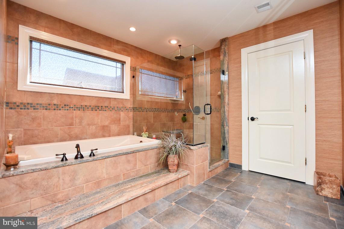 1023 Prospect Ridge Boulevard Haddon Heights, NJ 08035 - Photo 36 of 44 a spacious bathroom with a large tub shower and sink
