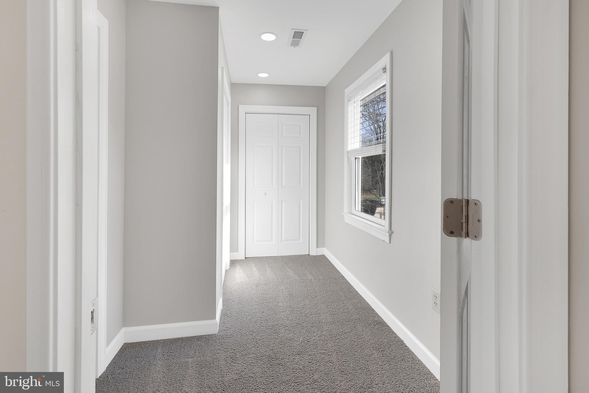 258 Martin Payne Road Kearneysville, WV 25430 - Photo 26 of 35 a view of a hallway with windows