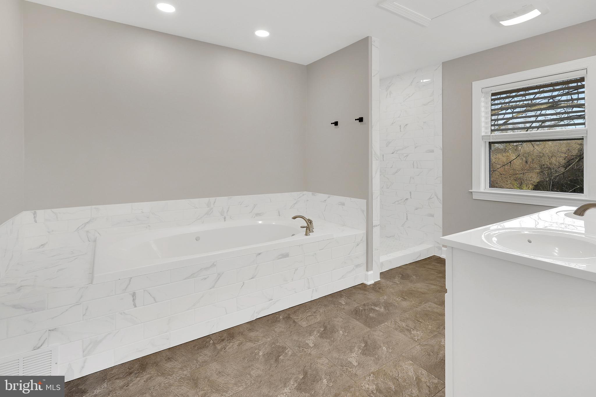 258 Martin Payne Road Kearneysville, WV 25430 - Photo 27 of 35 a bathroom with a bathtub and a shower