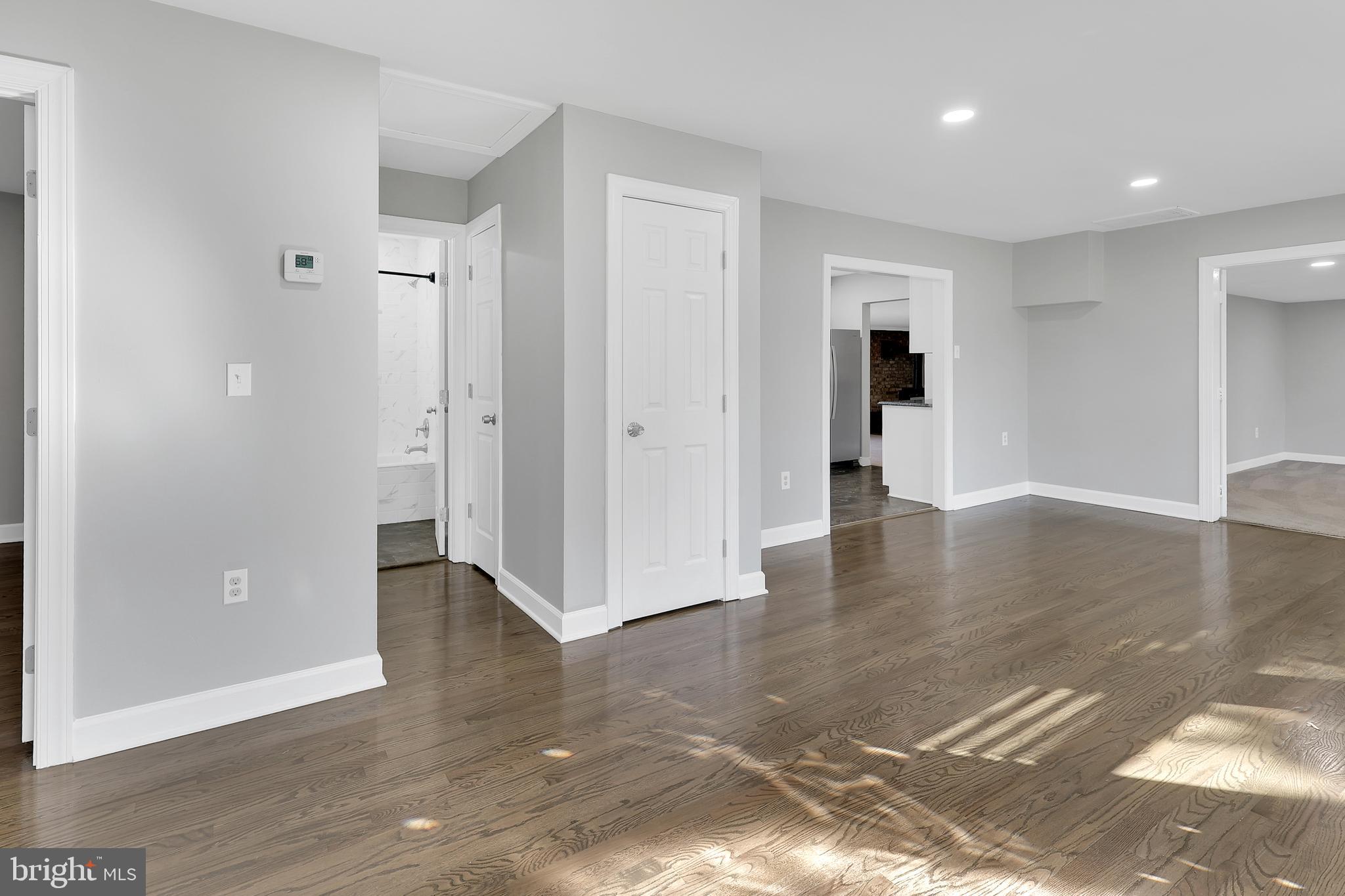258 Martin Payne Road Kearneysville, WV 25430 - Photo 5 of 35 a view of a big room with wooden floor and windows