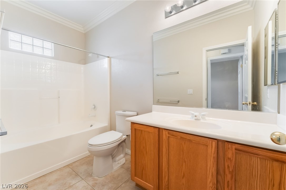 10481 Riverside Park Avenue Las Vegas, NV 89135 - Photo 27 of 51 Full bath 2 featuring vanity, ornamental molding, shower / washtub combination, and light tile patterned flooring