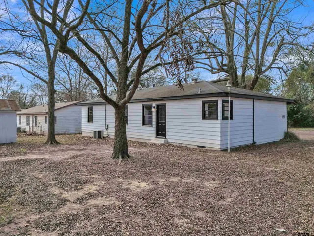 a house with trees in front of it