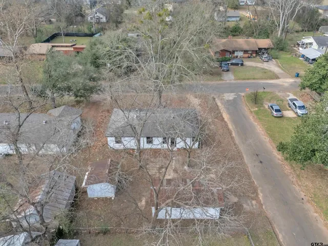 a view of a yard along with trees