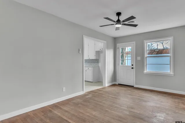 a view of an empty room with a window