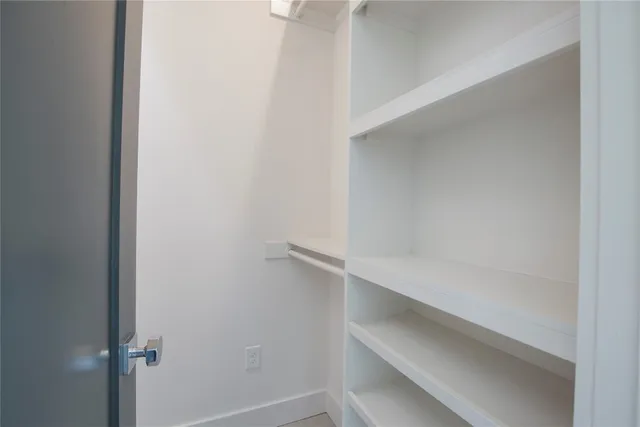 a view of an empty walk in closet