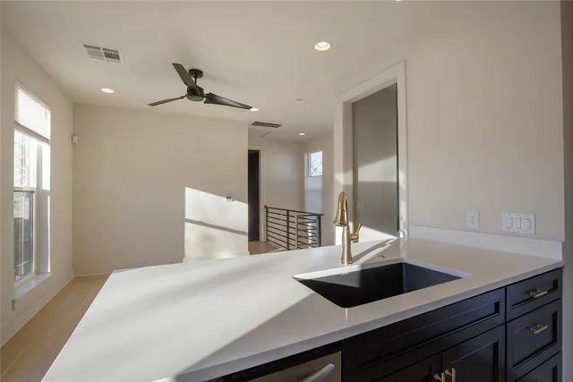a en suite bathroom with a sink and a mirror