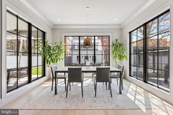 a dining room with furniture and window